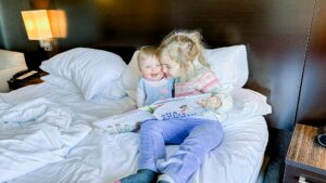 two girls reading together 